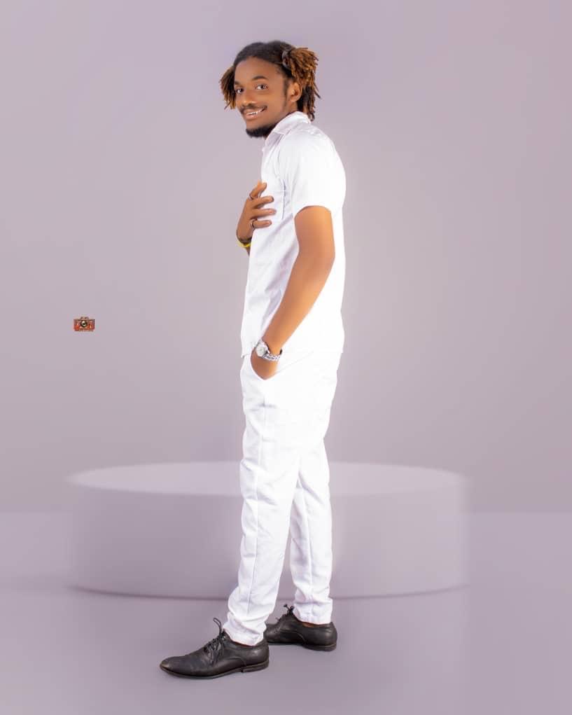 Jacob Sesay full-length studio portrait dressed in white